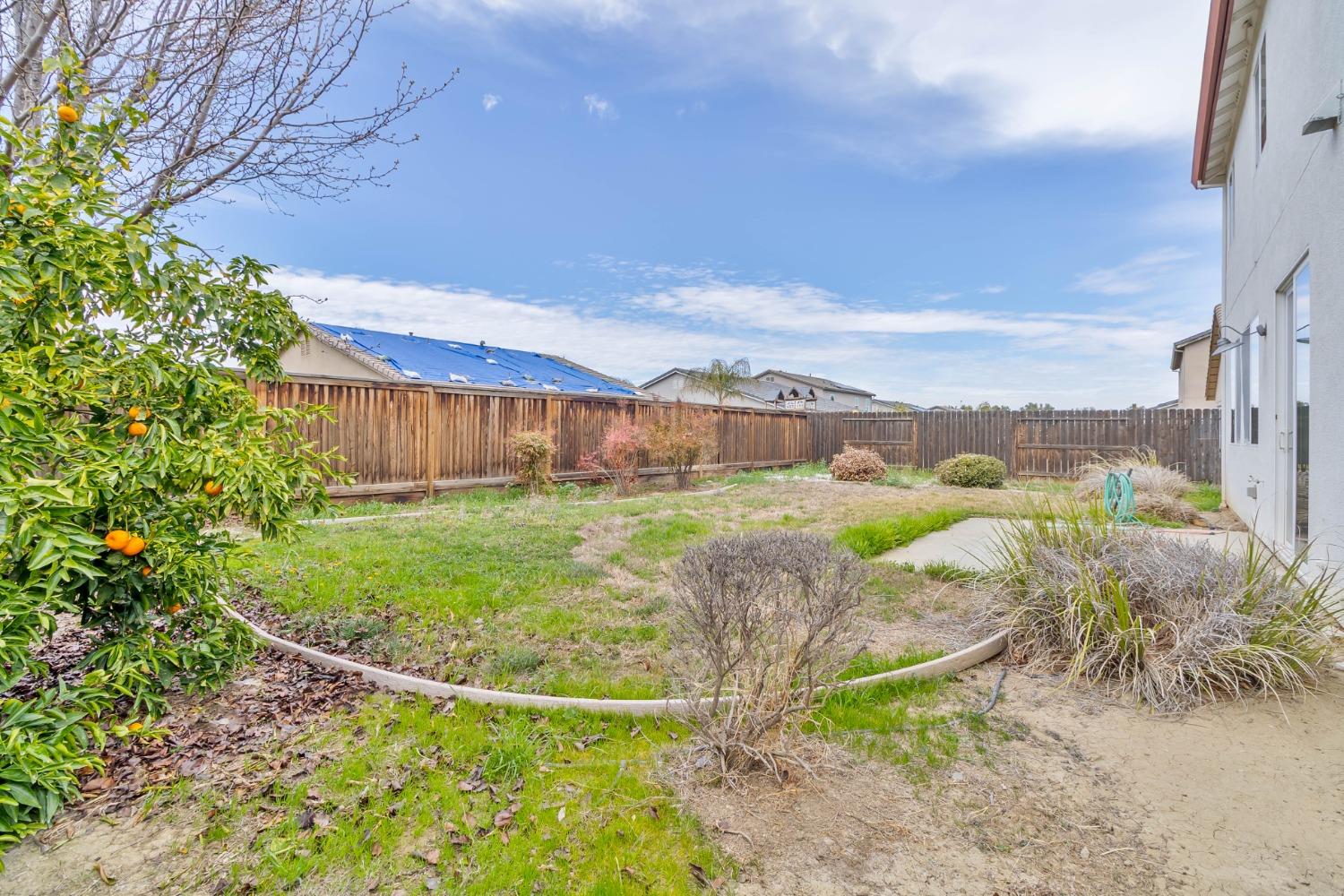 863 Chianti Circle Coalinga, CA 93210 - Photo 35 of 35 a view of a garden with a large pool table and chairs