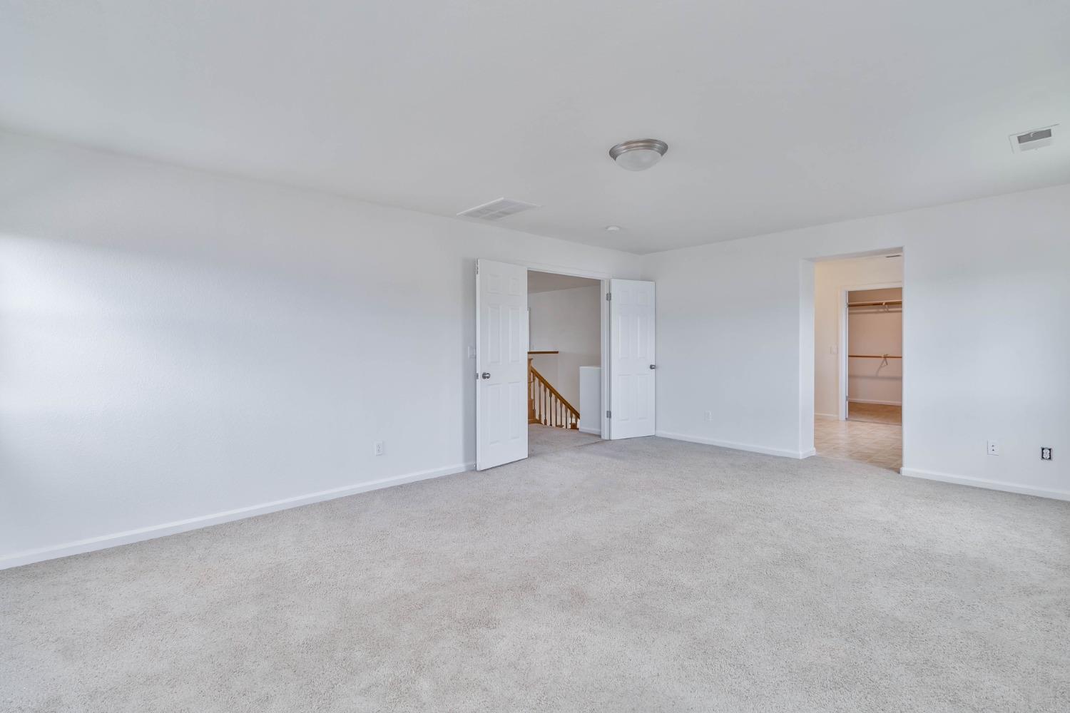 863 Chianti Circle Coalinga, CA 93210 - Photo 9 of 35 a view of an empty room and a window