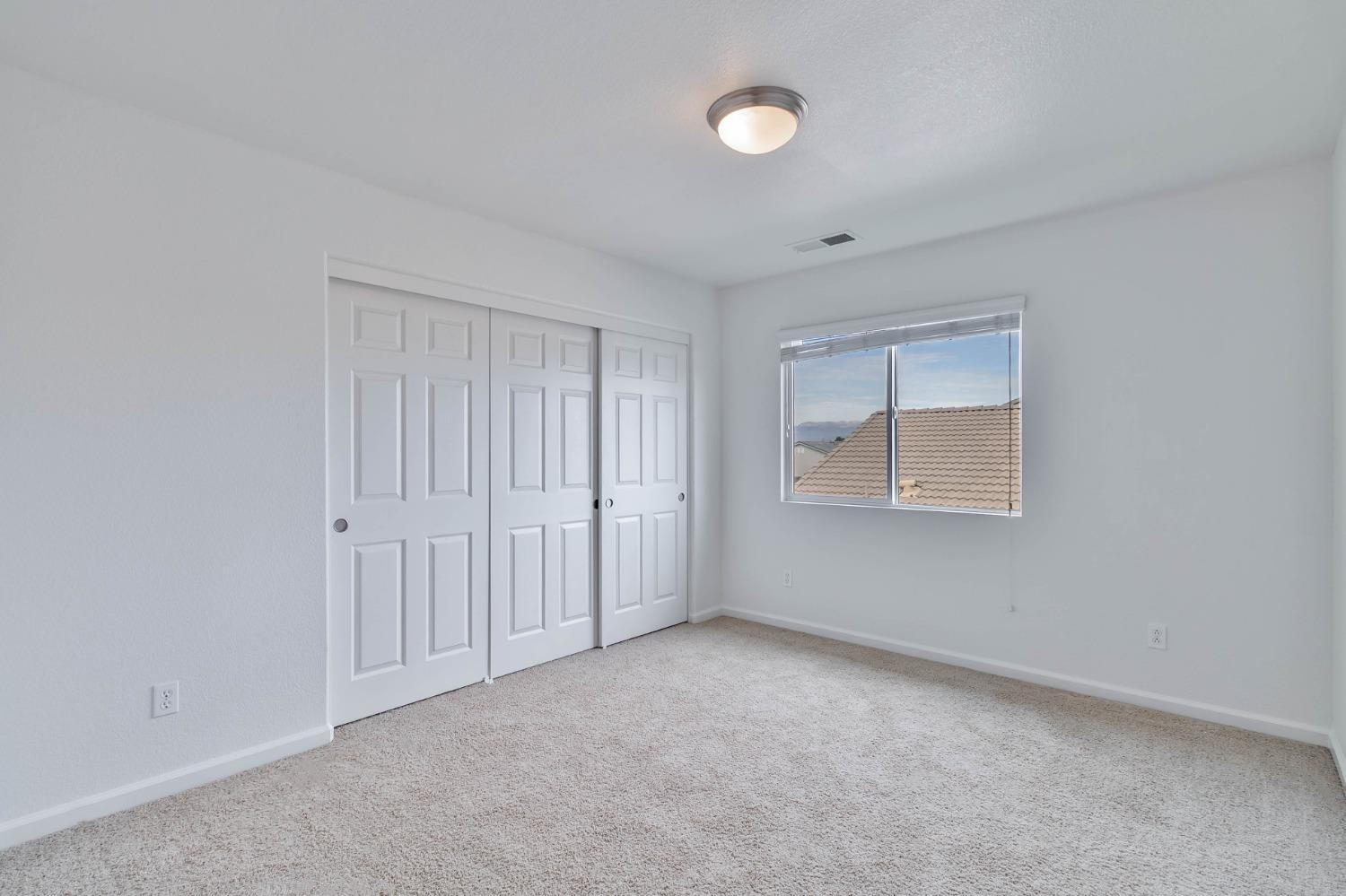 863 Chianti Circle Coalinga, CA 93210 - Photo 10 of 35 a view of an empty room with a window