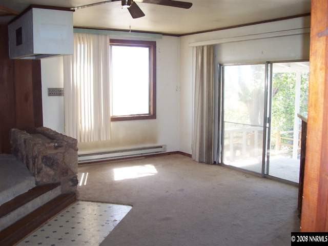 174 South Maddux Drive Reno, NV 89512 - Photo 5 of 8 a view of empty room with wooden floor and fan