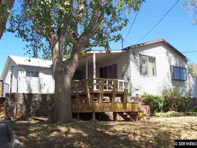 174 South Maddux Drive Reno, NV 89512 - Photo 7 of 8 a front view of a house with a yard