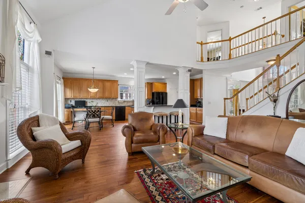 a living room with furniture or couch and a ceiling fan
