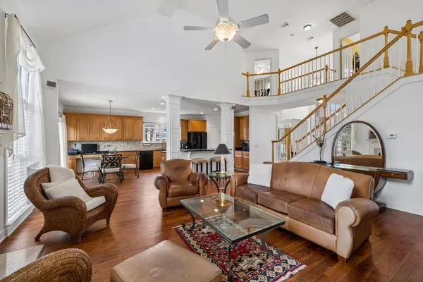a large kitchen with a table and chairs in it