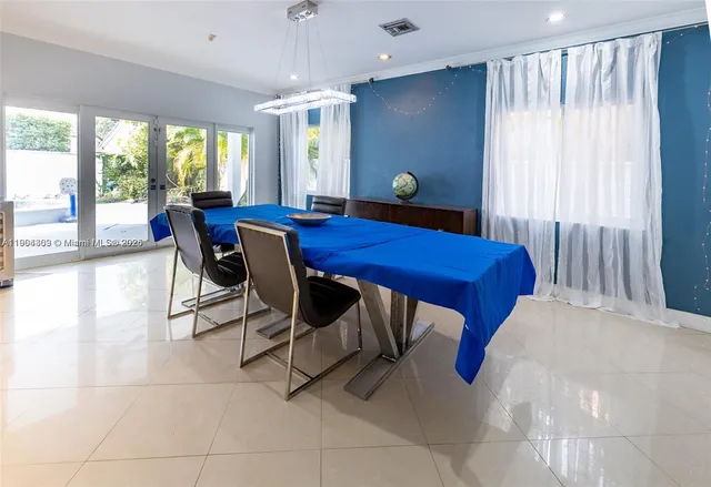 a living room with a large window and a table