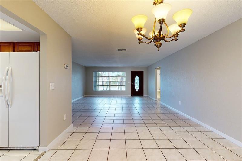 9728 Southwest 3rd Street Boca Raton, FL 33428 - Photo 2 of 7 a view of an empty room and window