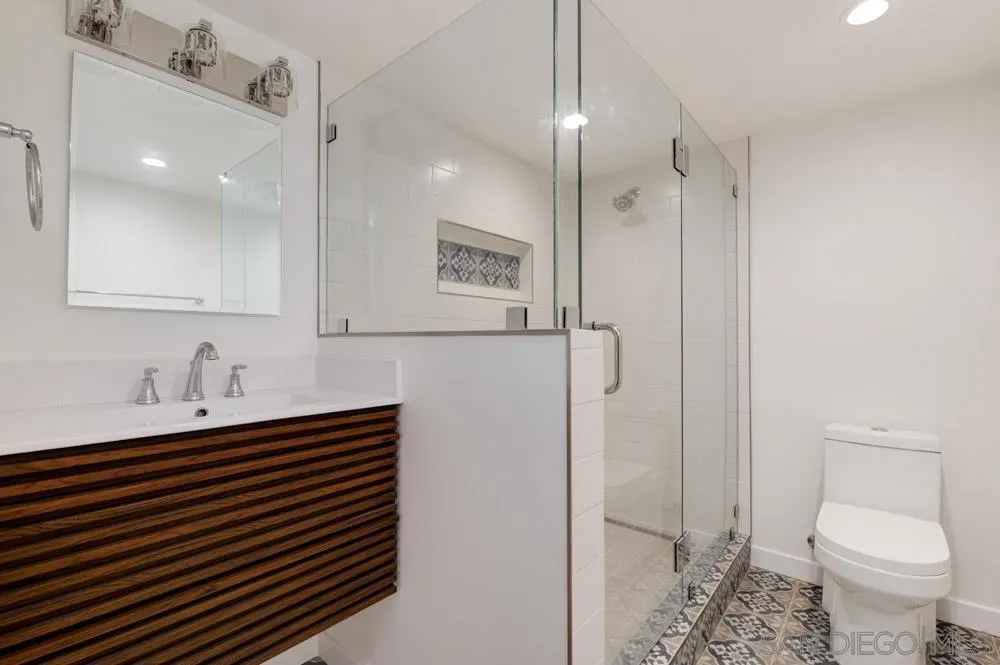 2633 Ocean Street Carlsbad, CA 92008 - Photo 12 of 23 a bathroom with a sink toilet and shower