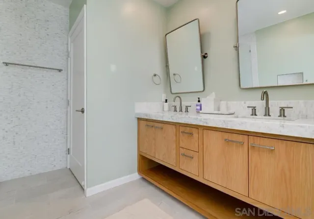 a bathroom with a sink and a mirror