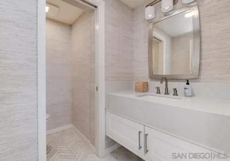 a balcony with furniture and wooden floor