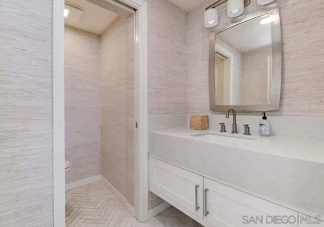 a balcony with furniture and wooden floor