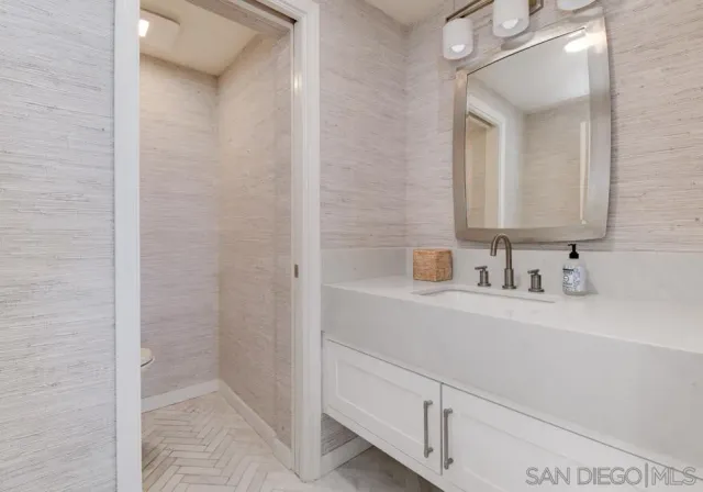 a balcony with furniture and wooden floor