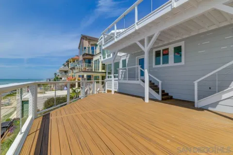 a view of a balcony with a couple of potted plants