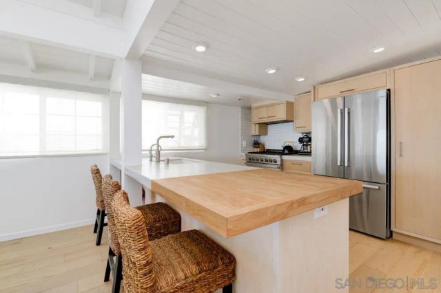 a living room with furniture window and wooden floor