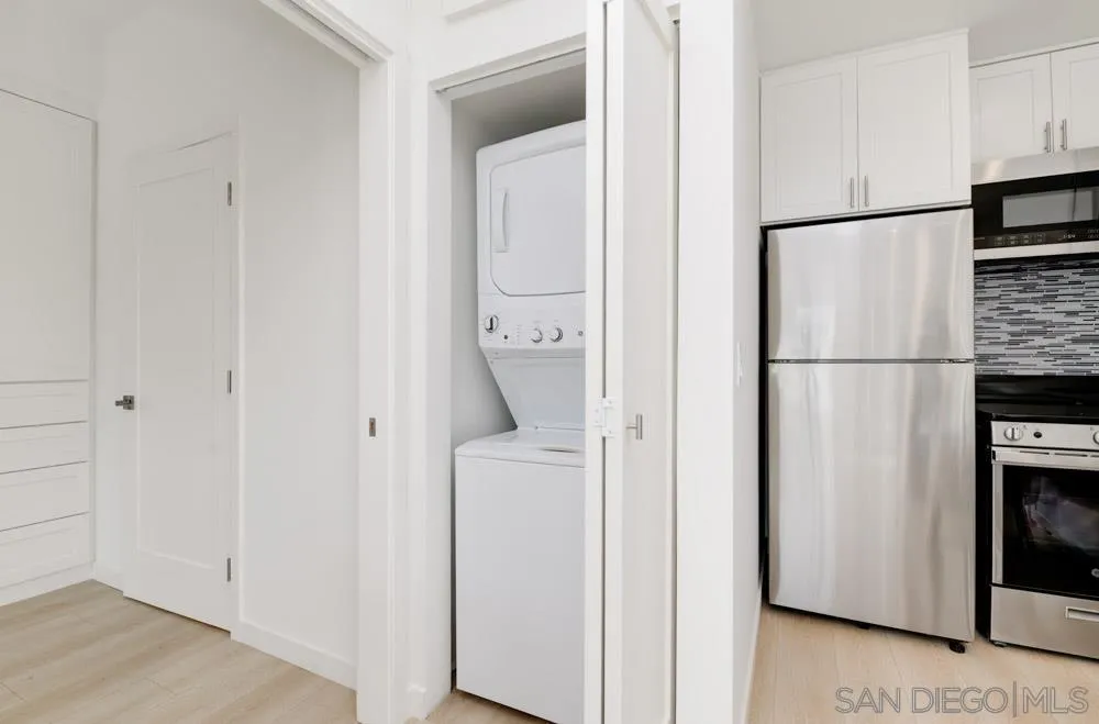 2633 Ocean Street Carlsbad, CA 92008 - Photo 8 of 23 a white refrigerator freezer and a stove sitting inside of a kitchen