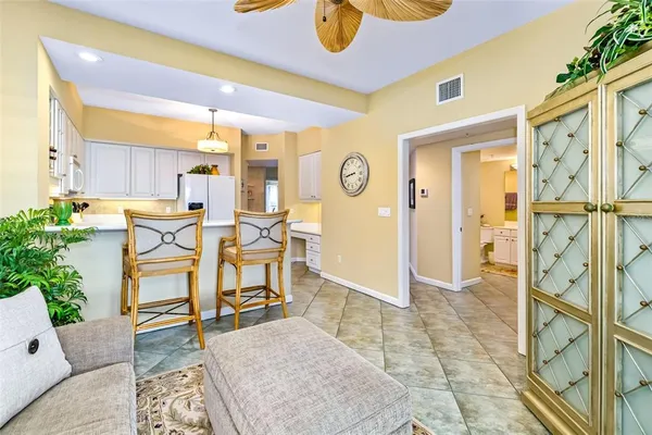 a kitchen with stainless steel appliances white cabinets and a sink