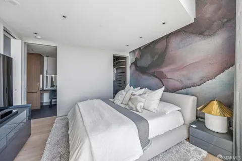 a bathroom with a granite countertop bathtub sink vanity and mirror