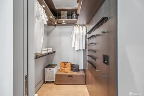 a bathroom with a granite countertop shower a toilet and a sink