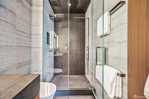 a bedroom with two beds and a window