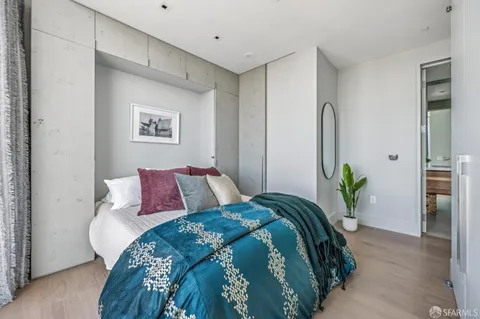 a living room with fireplace furniture and a large window