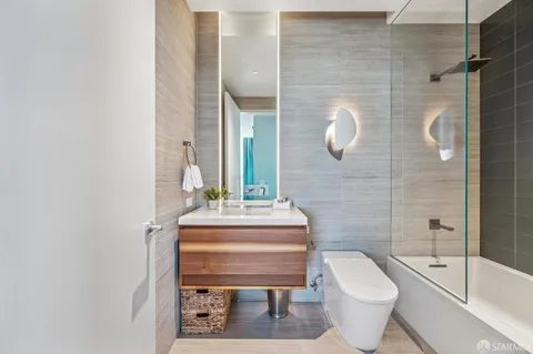 a view of a dining room with furniture and a potted plant