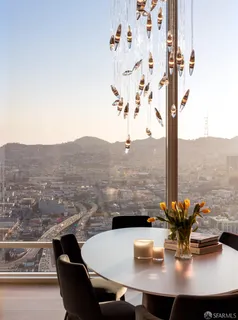 a view of a swimming pool with outdoor seating