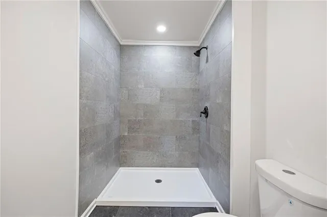 a bathroom with a shower and toilet