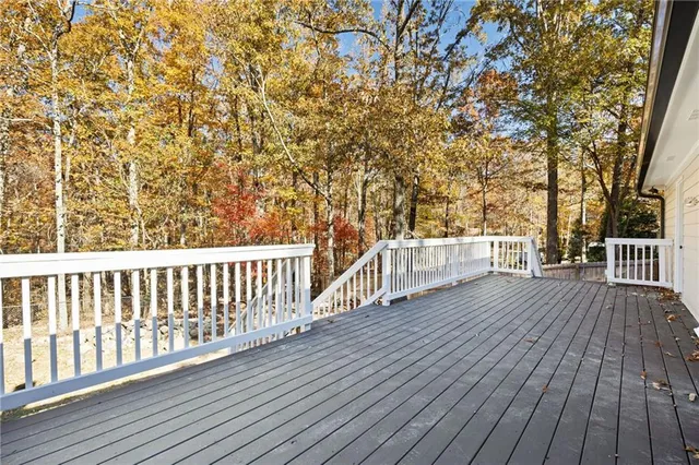 a view of deck with wooden floor and fence