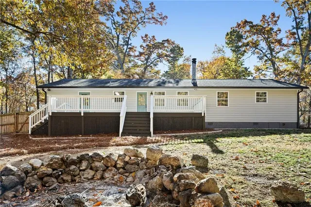 a view of house with yard