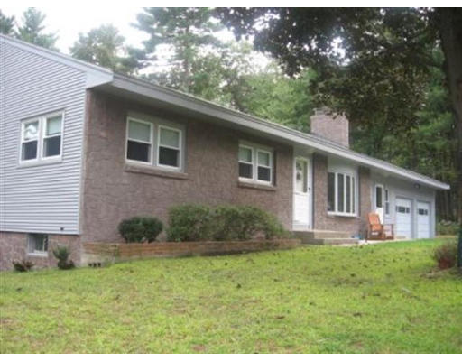 105 Baldwin Road Billerica, MA 01821 - Photo 1 of 17 a front view of a house with garden
