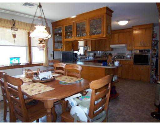 105 Baldwin Road Billerica, MA 01821 - Photo 2 of 17 a dining room with furniture a window and kitchen view
