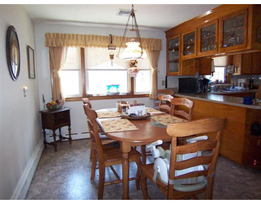 105 Baldwin Road Billerica, MA 01821 - Photo 5 of 17 a view of a dining room with furniture window and outside view