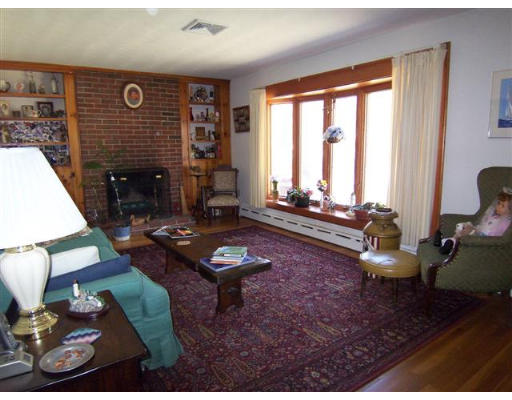 105 Baldwin Road Billerica, MA 01821 - Photo 6 of 17 a living room with furniture and a fireplace