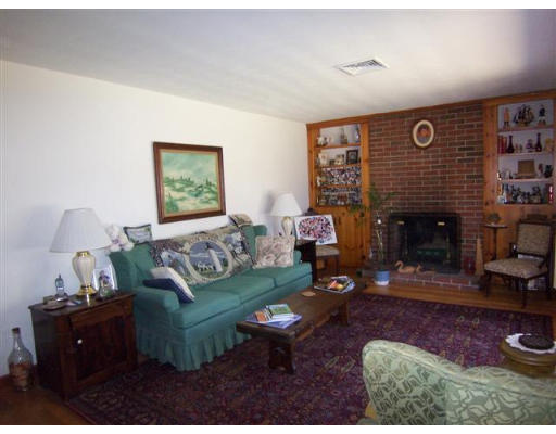 105 Baldwin Road Billerica, MA 01821 - Photo 7 of 17 a living room with furniture and a fireplace