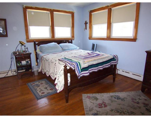 105 Baldwin Road Billerica, MA 01821 - Photo 9 of 17 a bedroom with a bed and a window