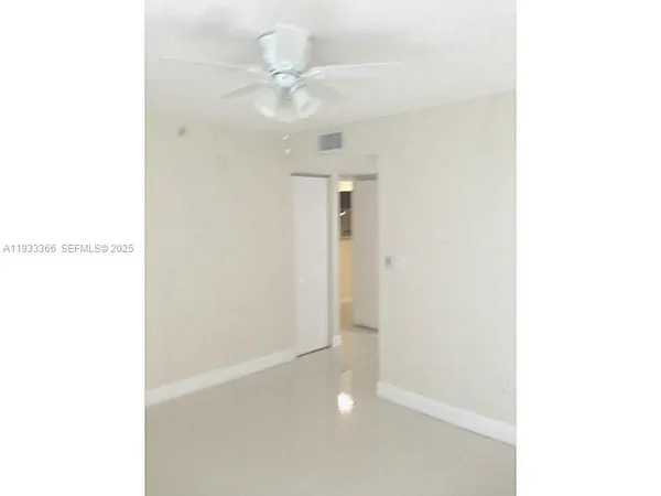 a view of a hallway with a white walls