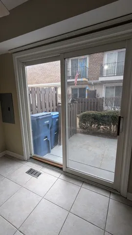 a view of a glass door and a window
