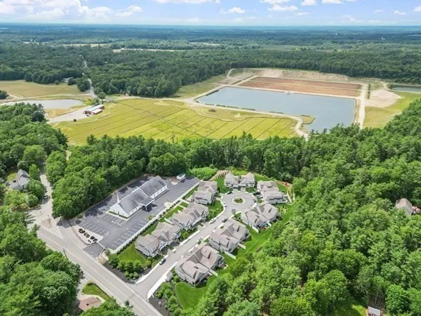 an aerial view of residential houses with outdoor space