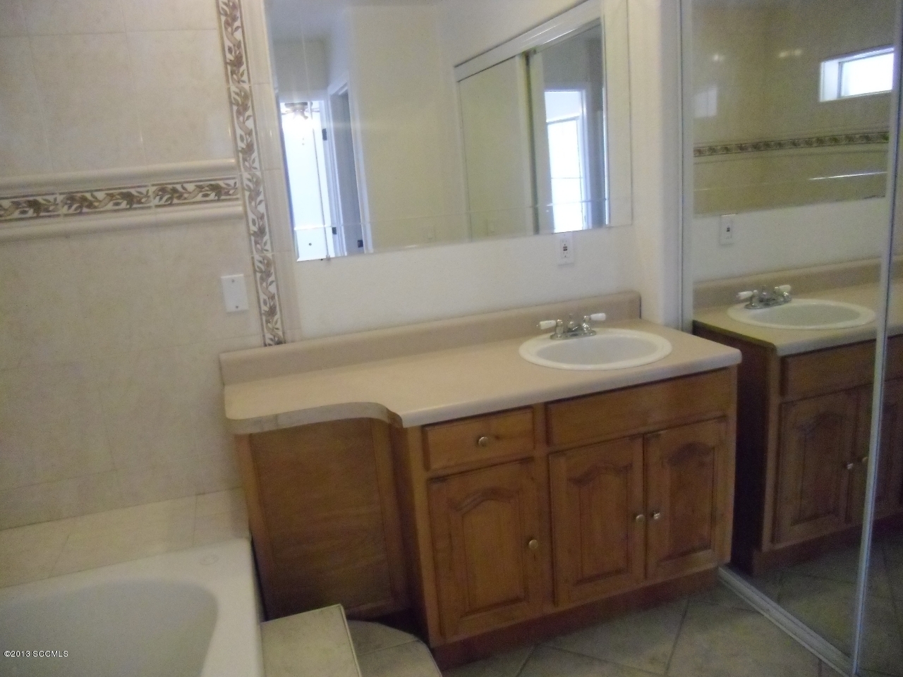 264 Paseo Mascota Rio Rico, AZ 85648 - Photo 23 of 39 a bathroom with a sink and a mirror