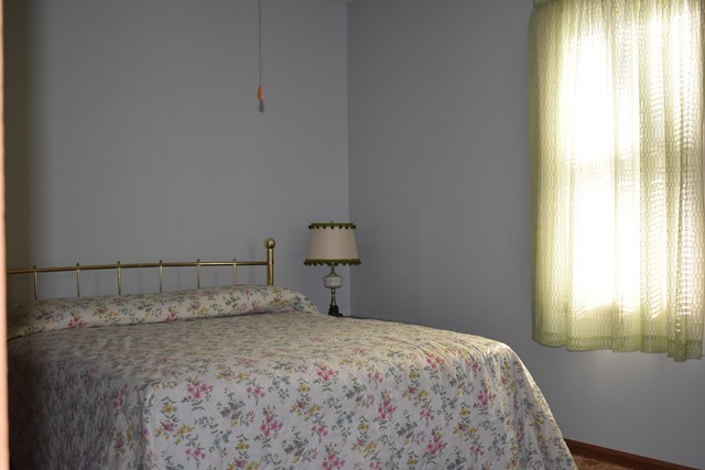 135 Taylor Road Gray, GA 31032 - Photo 13 of 28 a bedroom with a bed and a window