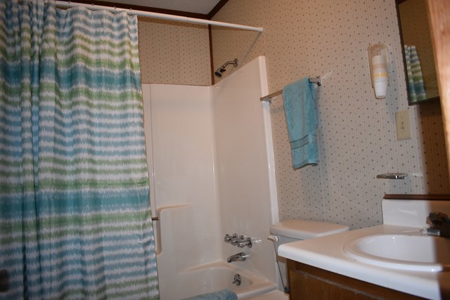 135 Taylor Road Gray, GA 31032 - Photo 20 of 28 a bathroom with a sink and a mirror