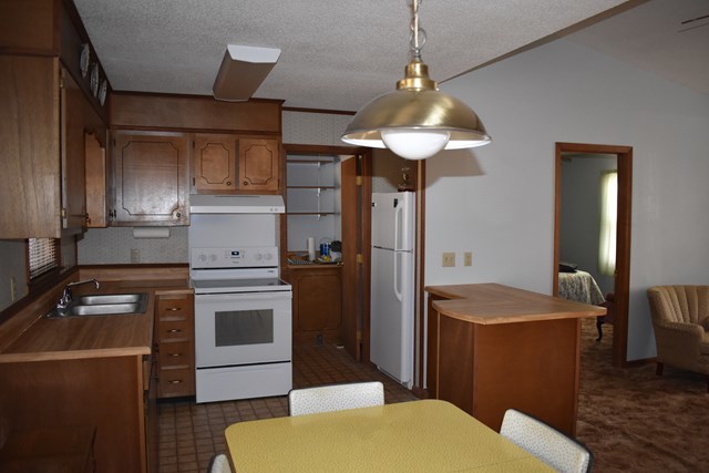 135 Taylor Road Gray, GA 31032 - Photo 8 of 28 a kitchen with stainless steel appliances granite countertop a sink a stove and a refrigerator