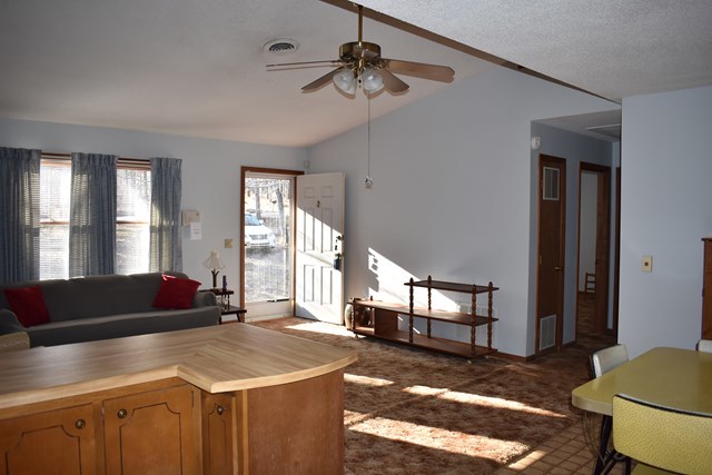 135 Taylor Road Gray, GA 31032 - Photo 10 of 28 a living room with furniture and a chandelier