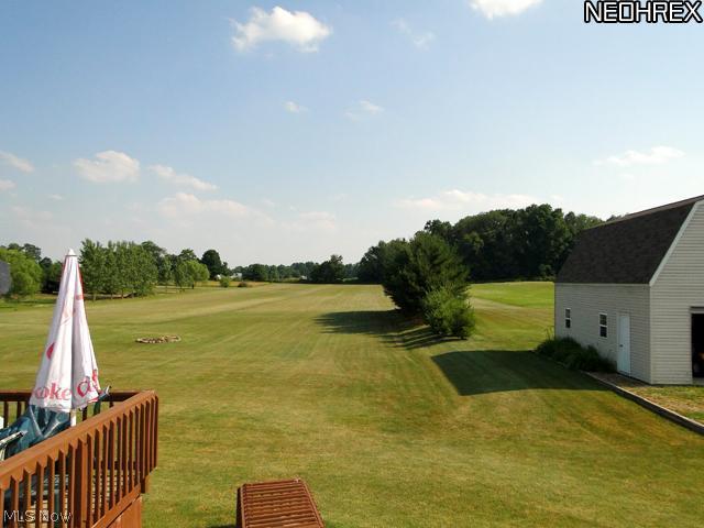 5380 Seville Road Seville, OH 44273 - Photo 14 of 17 Look out onto the scenic lot from the relaxing custom deck.