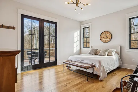 a bedroom with a large bed and a window
