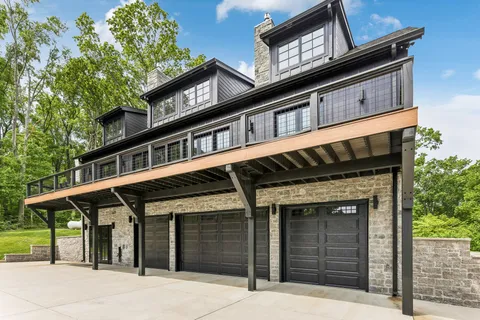 a front view of a house with a garage