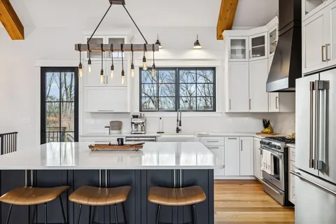 a kitchen with granite countertop a sink and a stove