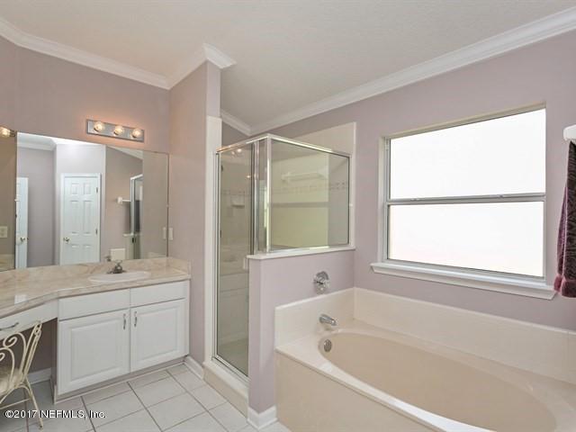 4445 Mandarin Ridge Court Jacksonville, FL 32258 - Photo 13 of 33 a bathroom with a tub sink and mirror