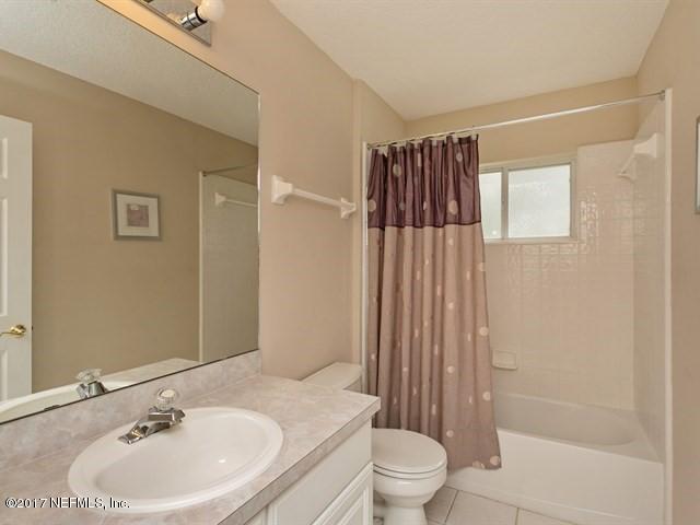 4445 Mandarin Ridge Court Jacksonville, FL 32258 - Photo 14 of 33 a bathroom with a sink a toilet and shower