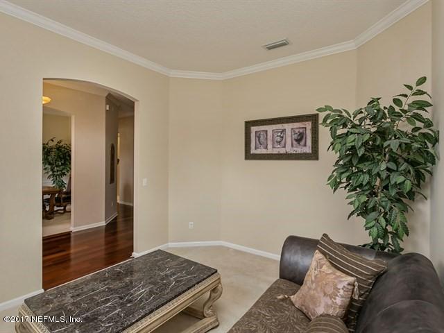 4445 Mandarin Ridge Court Jacksonville, FL 32258 - Photo 15 of 33 a living room with furniture plant and a window