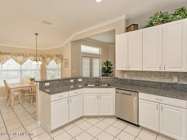 4445 Mandarin Ridge Court Jacksonville, FL 32258 - Photo 2 of 33 a kitchen with a sink and cabinets