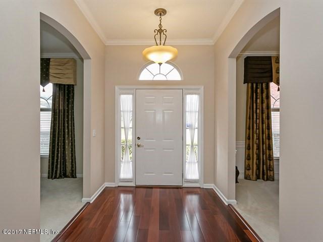 4445 Mandarin Ridge Court Jacksonville, FL 32258 - Photo 23 of 33 wooden floor in an empty room with a window